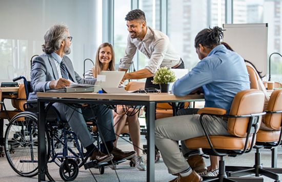 Photo of a group of diverse professionals collaborating around a table