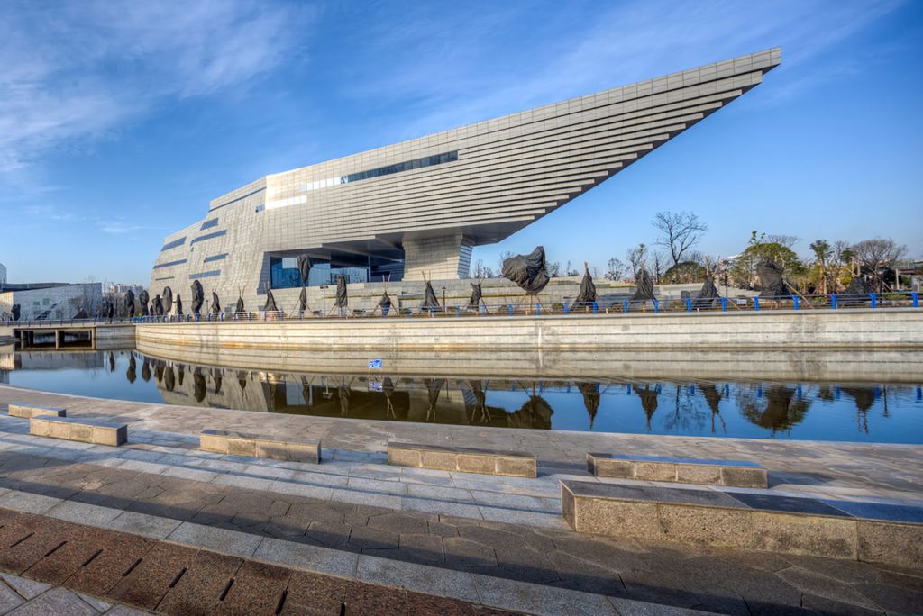 Detailed view of the asymmetrical roof structure resembling a floating staircase.