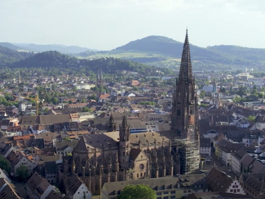 An aerial shot of an old German castle-looking building