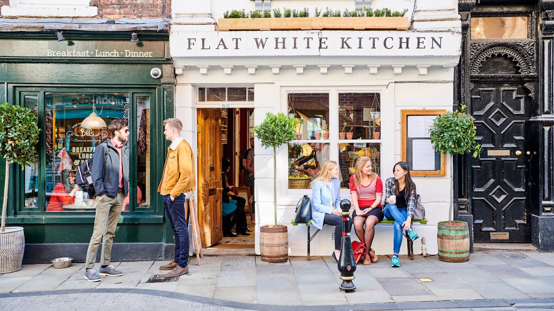 Students sitting in front of a cafe in Durham