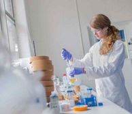 Girl with long hair working in a lab