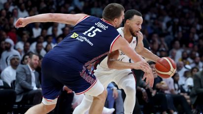 Getty Images - ABU DHABI, UNITED ARAB EMIRATES - JULY 17: Stephen Curry #4 of the United States drives to the basket guarded by Nikola Jokic #15 of Serbia during the first half of an exhibition game between the United States and Serbia ahead of the Paris Olympic Games at Etihad Arena on July 17, 2024 in Abu Dhabi, United Arab Emirates. (Photo by Christopher Pike/Getty Images)