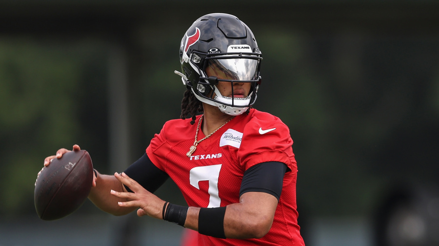 Getty Images - HOUSTON, TEXAS - JUNE 04: C.J. Stroud #7 of the Houston Texans looks to pass during Mandatory Minicamp at Houston Methodist Training Center on June 04, 2024 in Houston, Texas. (Photo by Tim Warner/Getty Images)