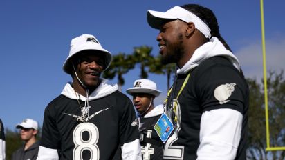 Getty Images - KISSIMMEE, FLORIDA - JANUARY 22: Lamar Jackson #8 of the Baltimore Ravens visits with Derrick Henry #22 of the Tennessee Titans during the AFC team practice in preparation for the 2020 Pro Bowl, Wednesday, Jan. 22, 2020, in Kissimmee, Florida. (Photo by Cooper Neill/Getty Images)