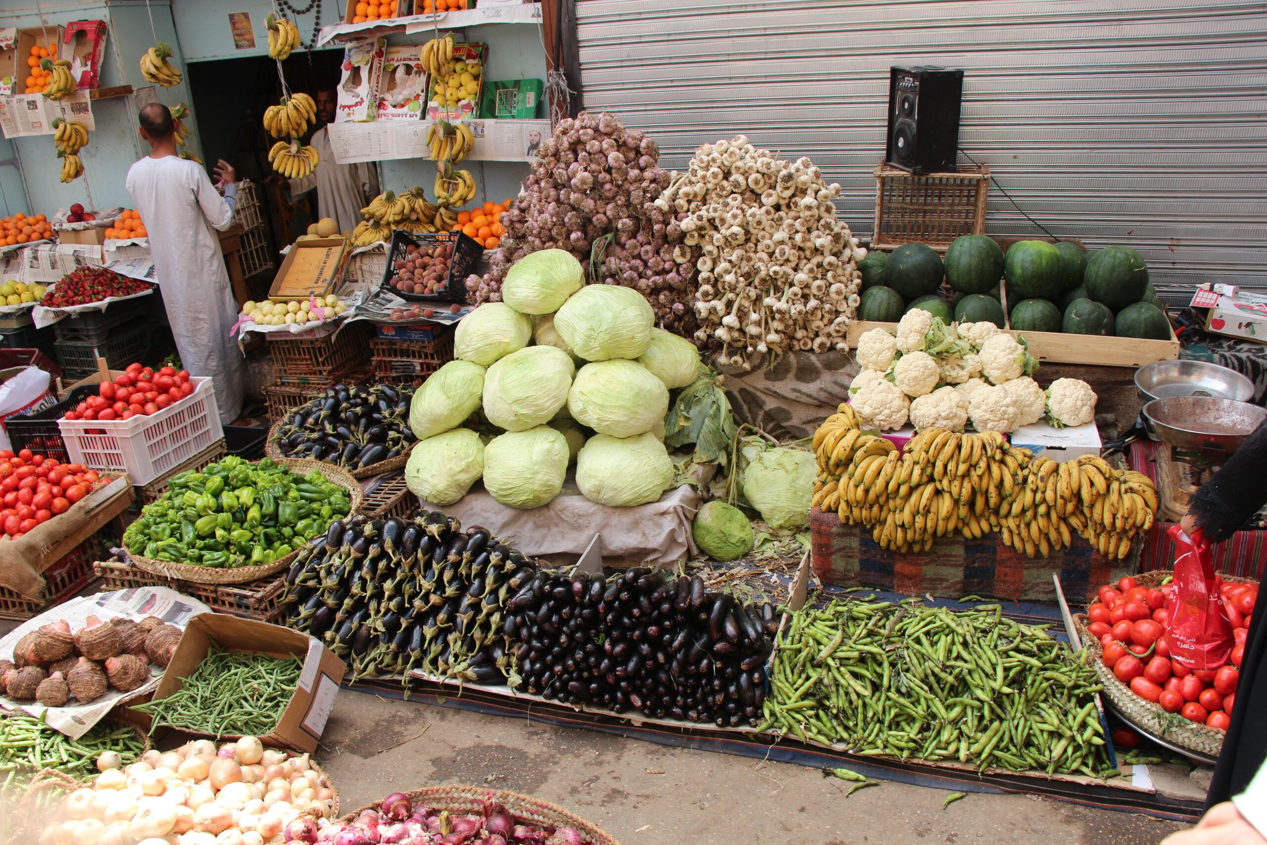 Piles of vegetables in a street market.