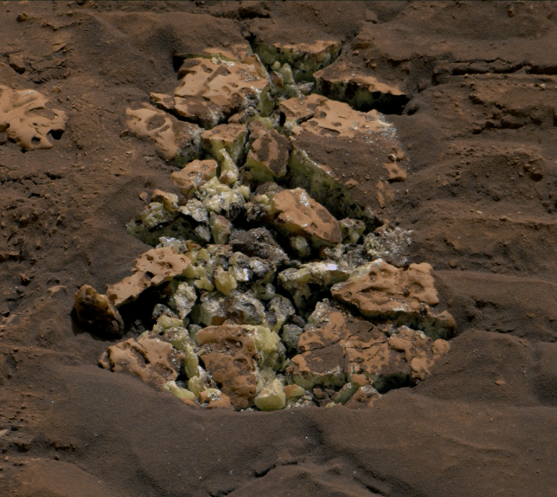 These yellow crystals were revealed after NASA’s Curiosity happened to drive over a rock and crack it open on May 30. Using an instrument on the rover’s arm, scientists later determined these crystals are elemental sulfur — and it’s the first time this kind of sulfur has been found on the Red Planet.