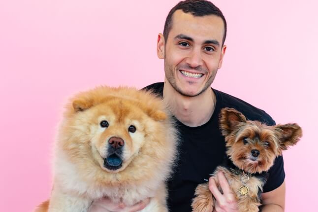 Harvard SEAS alum Marc Atiyeh, A.B. '14, with two dogs