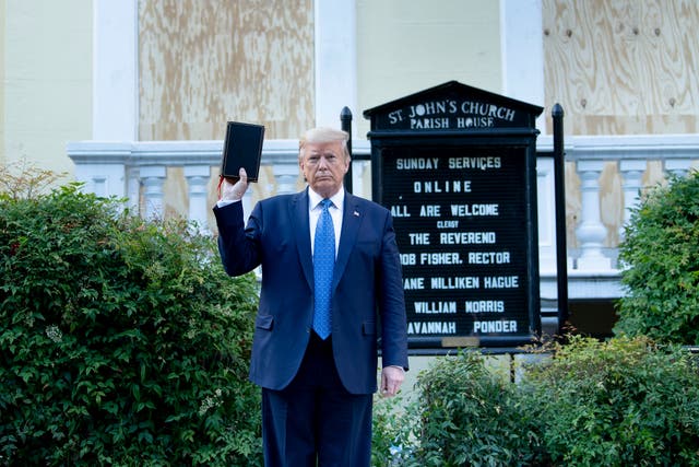 Donald Trump holds a Bible outside of St. John’s Church in Washington, DC following Black Lives Matter demonstrations. Some speculated Trump was holding the Bible upside down