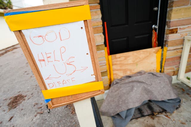 <p>A message is seen outside of an apartment in the Davis Islands community of Tampa, Florida as residents prepare for the arrival of Hurricane Milton, Tuesday, Oct. 8, 2024</p>