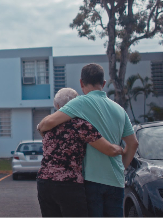 Googler with family member after a hurricane in Puerto Rico.