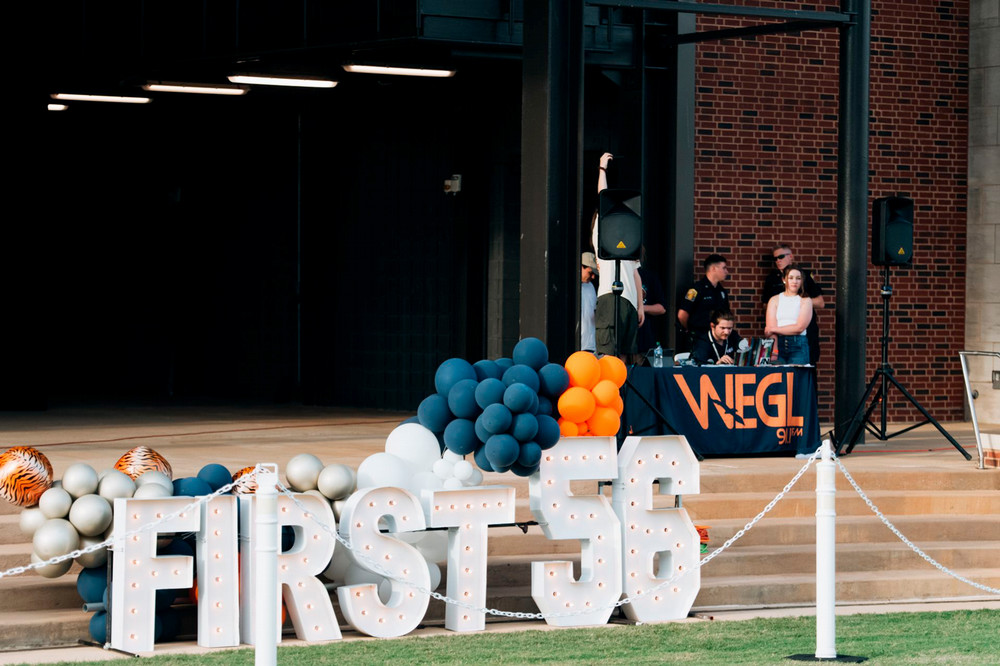 Large letters spell out First 56 in front of concrete stairs