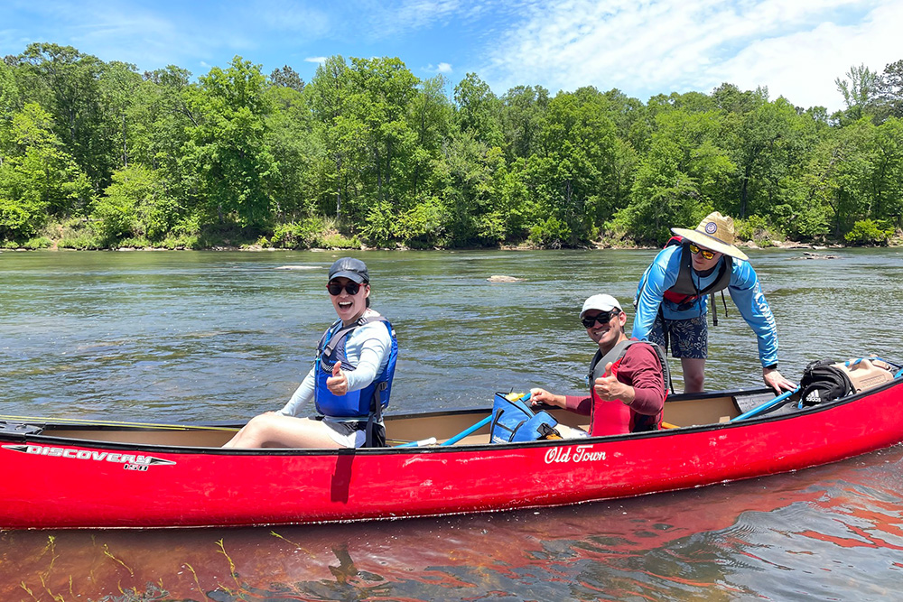 Students in a canoe on the water