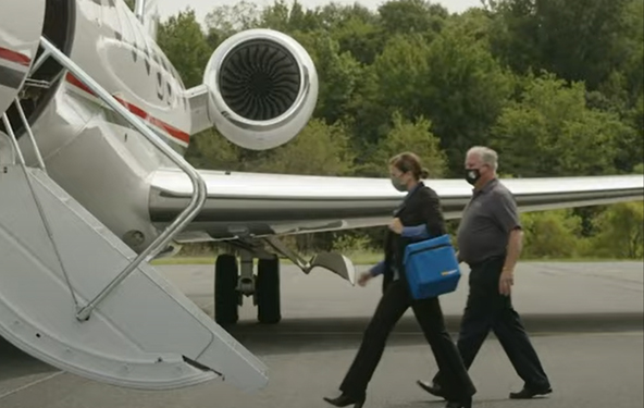 Team boarding aircraft