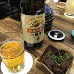 ushino - ビール（700円）と、お通しの牛煮込み（500円）