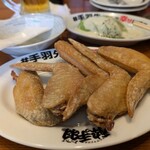 Izakaya Kakumei Yotteba Kawasaki Nakamisedori Ten - 名物手羽先@\100円（日替りイベント）