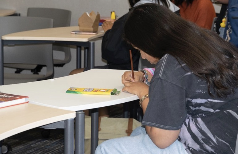 Student participating in a Spanish Honor Society. 