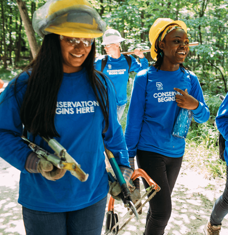 SCA crew members laughing while walking