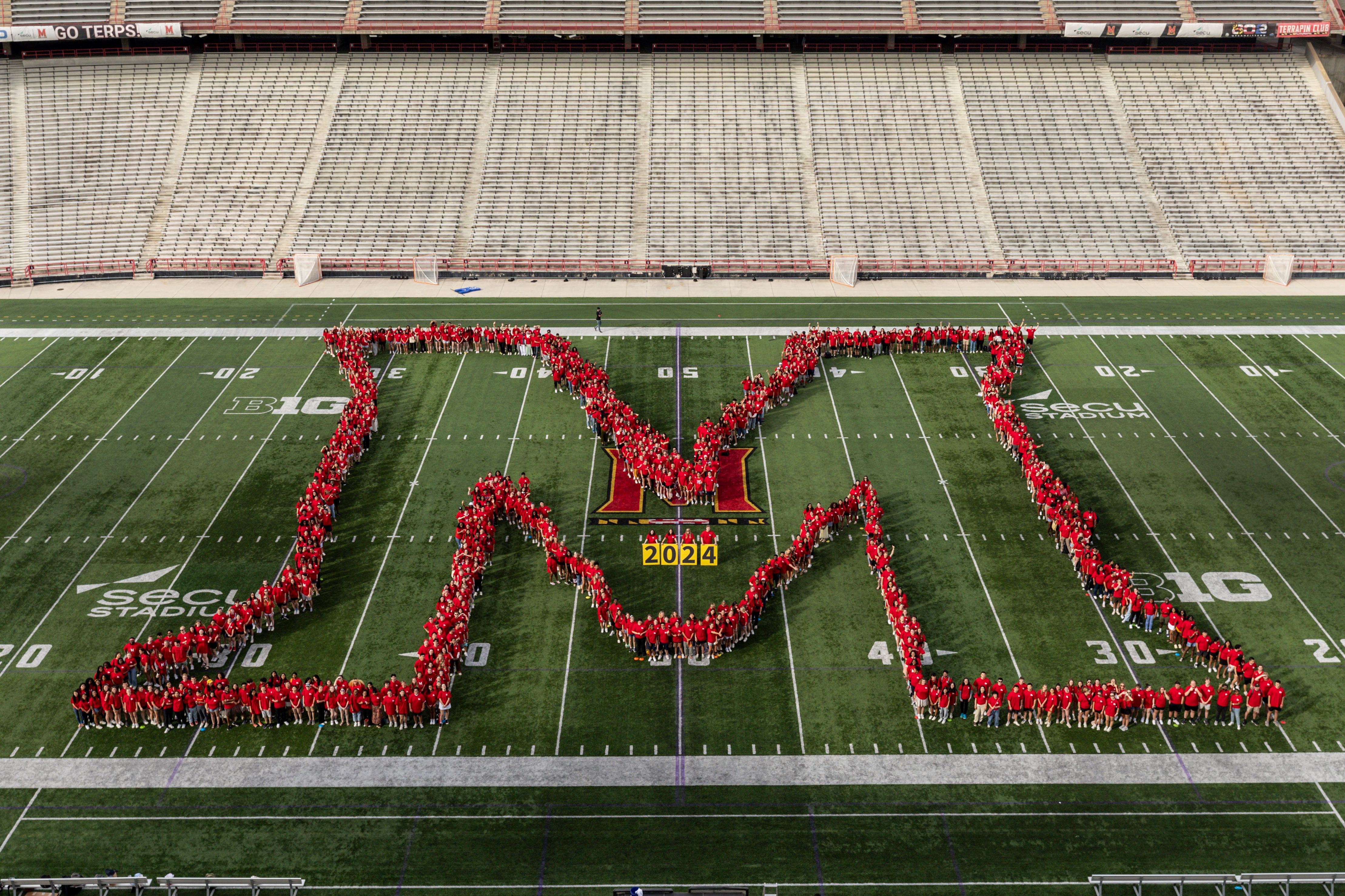 Students spelling out the Maryland M at SECU Stadium 2024