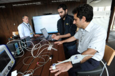 A research team in the MCIRCC Ideation Lab works on a sensor ring that collects patient's vital health data.