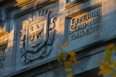 The sun sets on Hutchins Hall on central campus.