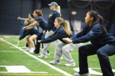 Members of the women's tennis team have an early morning workout at the Oosterbaan Field House.