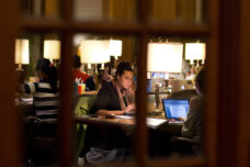 A graduate student studies in the busy lounge at the Michigan Union.