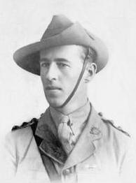 Head and shoulders of a young man in a shirt, tie, and slouch hat