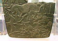 Image 19Possible prisoners and wounded men of the Buto-Maadi culture devoured by animals, while one is led by a man in long dress, probably an Egyptian official (fragment, top right corner). Battlefield Palette. (from Prehistoric Egypt)