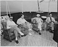 President Truman and members of his staff relaxing on the afterdeck of the yacht USS Williamsburg.