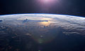 Image 11Sunset over the Pacific Ocean as seen from the International Space Station. Tops of thunderclouds are also visible. (from Pacific Ocean)