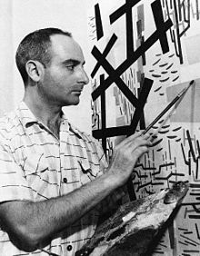 Mimmo Rotella al lavoro nel suo studio, Roma 1951