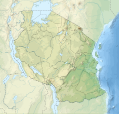 Mapa konturowa Tanzanii, u góry nieco na prawo znajduje się czarny trójkącik z opisem „Meru”