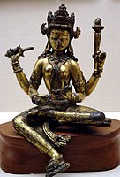 One of the Matrikas, Nepal, gilt-bronze, 14th century. The pendent foot "rests" on a small lotus throne, itself unsupported.