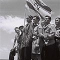 Buchenwald concentration camp survivors sailing to Haifa at "Mataroa" (ship) Carry the Zionist flag, 15 June 1945