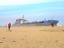 Children playing near 'Hansitha' at Mundakkal coast