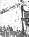 Illegal immigrants on board "Josiah Wedgwood" (ship), waving a banner, June 1946