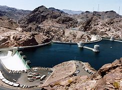 Water enters Hoover Dam's Arizona drum-gate spillway (left) during the 1983 floods.