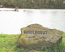 A boulder engraved with the Kalapuyan word "Whilamut" "Where the river ripples and runs fast"