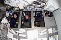 Three crewmembers in their bunk beds