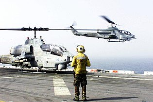 13 octombrie: Pe mare, la bordul navei de asalt amfibie USS Peleliu, elicopterele AH-1W "Super Cobra", decolează de pe puntea de zbor a navelor în drum spre Afghanistan