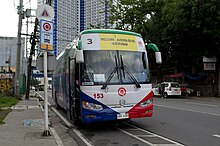 A bus next to a bus stop