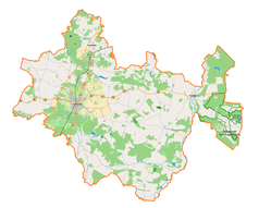 Mapa konturowa powiatu radomszczańskiego, po lewej znajduje się punkt z opisem „Radomsko”