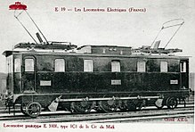 French boxcab locomotive with the motors mounted beyond the coupled axles, driving by extended coupling rods from external jackshafts