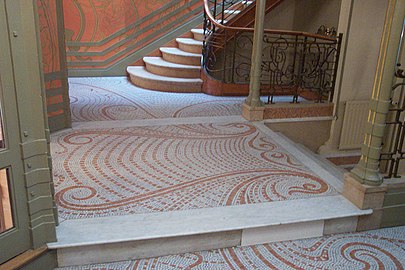 Mosaic floor with the characteristic whiplash curving lines