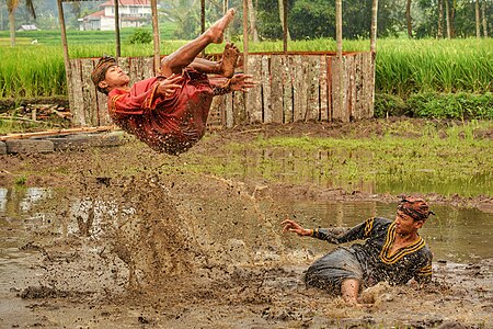 Silek Lanyah 2020 - Two men performing martial art in a stream