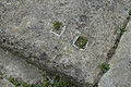 Cuttings in the raised platforms in the dining rooms for the legs of couches. The lead used to secure the legs is visible.