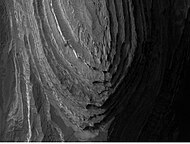 Layers in Terby crater may have formed when the Hellas basin was filled with water.