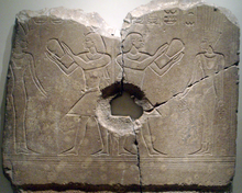 Sobekhotep III worshipping Satet (left) and Anuket (right). The central hole was made when the relief was used as a grinding stone, long after the original carving. Now on display at the Brooklyn Museum.