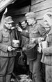 Sergeant gives soldier food, right: wounded with head and arm injuries, the end of January - beginning of May 1942
