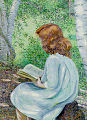 Child with red hair reading